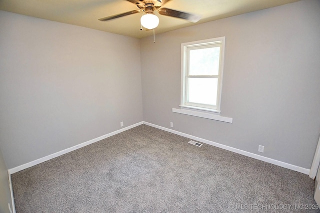 spare room with carpet and ceiling fan