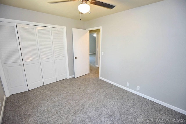 unfurnished bedroom featuring carpet, a closet, and ceiling fan