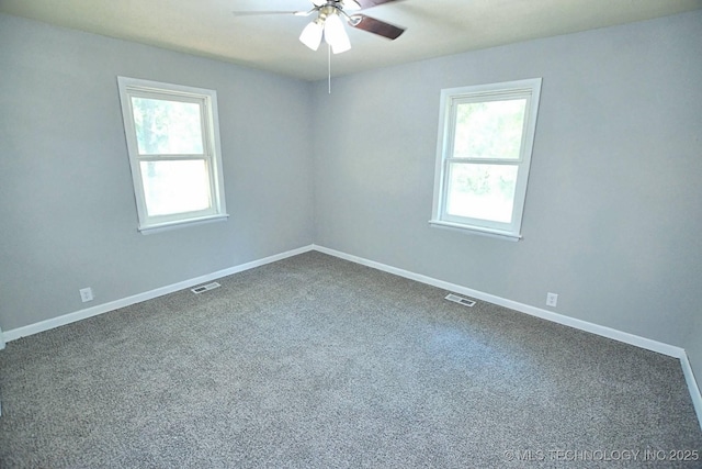 carpeted empty room featuring ceiling fan