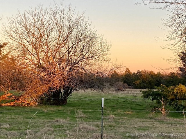 591 Peanut Trl, Hendrix, OK 74741 - yard at dusk with a view of rural / pastoral area