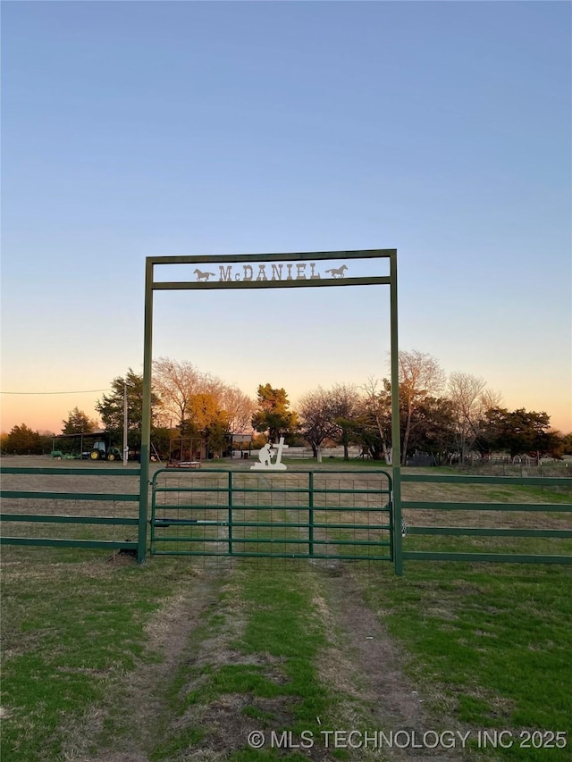 yard at dusk with a rural view