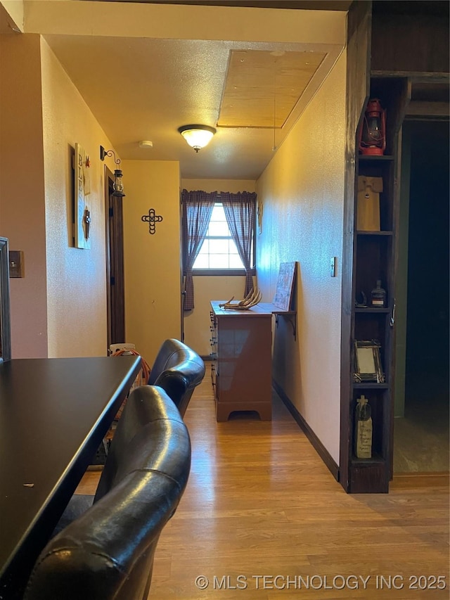 interior space with hardwood / wood-style flooring and a textured ceiling