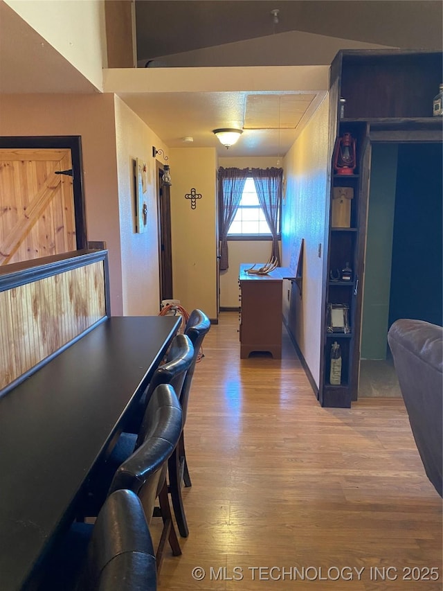 dining space with hardwood / wood-style floors