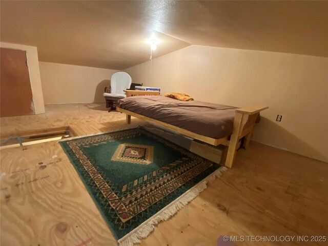591 Peanut Trl, Hendrix, OK 74741 - bedroom featuring lofted ceiling and wood finished floors