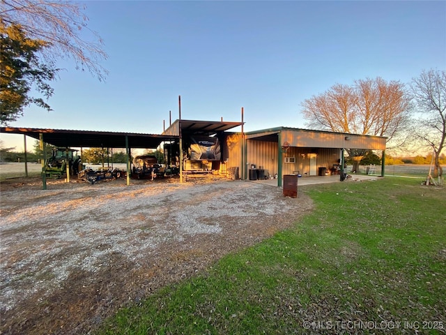 exterior space with central air condition unit and a carport