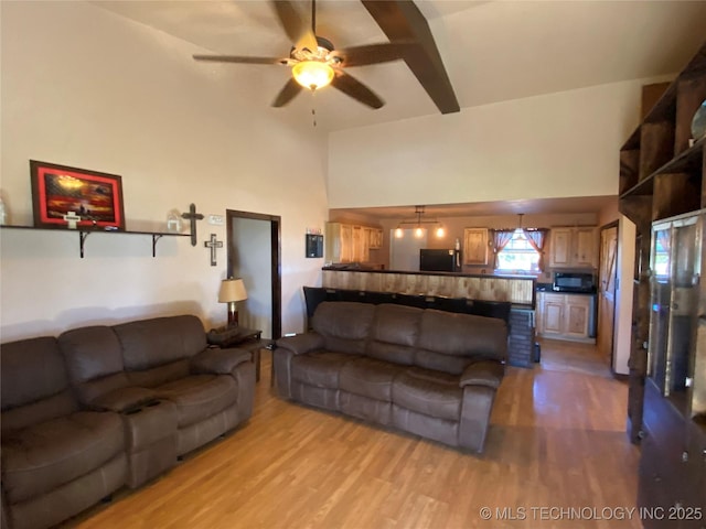 living room featuring light wood-type flooring and ceiling fan