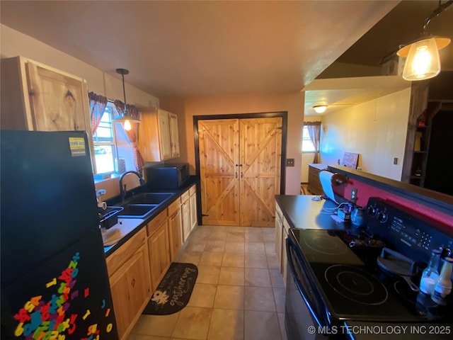 591 Peanut Trl, Hendrix, OK 74741 - kitchen featuring range, a sink, freestanding refrigerator, dark countertops, and light tile patterned flooring