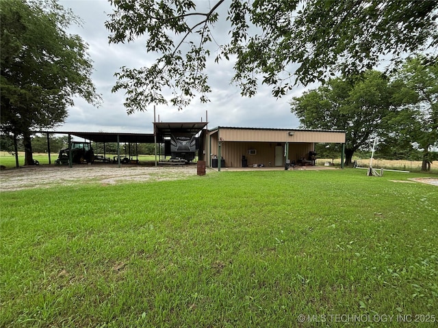 591 Peanut Trl, Hendrix, OK 74741 - rear view of property with a yard and driveway