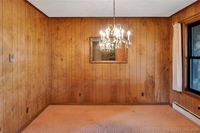 unfurnished dining area featuring a chandelier, wood walls, light colored carpet, and a baseboard heating unit