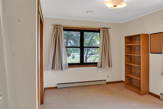 unfurnished room featuring light colored carpet and a baseboard heating unit