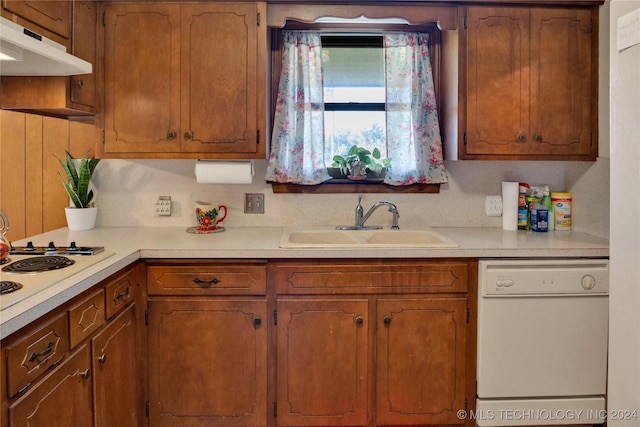 kitchen with white appliances and sink