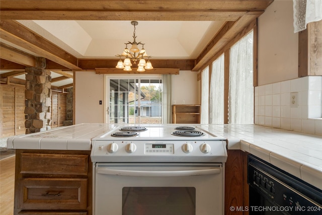 kitchen featuring dishwasher, tile counters, white electric stove, backsplash, and a chandelier