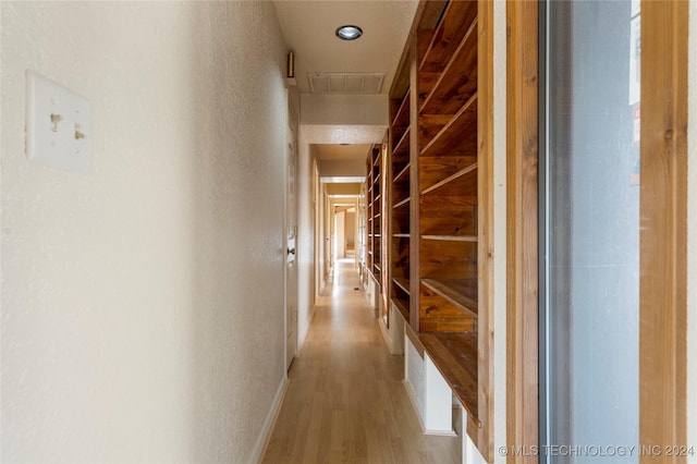 corridor featuring light hardwood / wood-style flooring