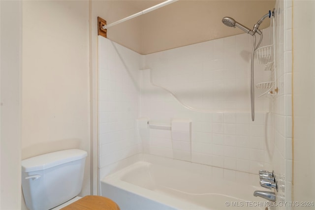 bathroom featuring bathing tub / shower combination and toilet