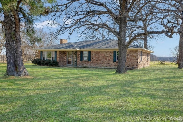 ranch-style house with a front lawn