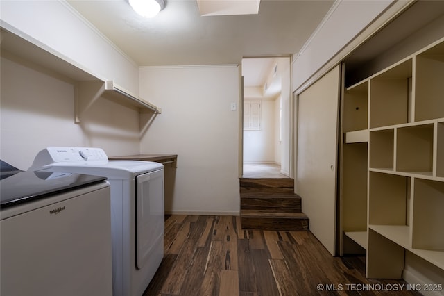 laundry room with washer and clothes dryer, crown molding, and dark wood-type flooring