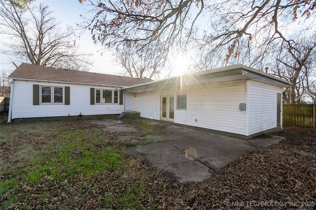 back of house with a patio