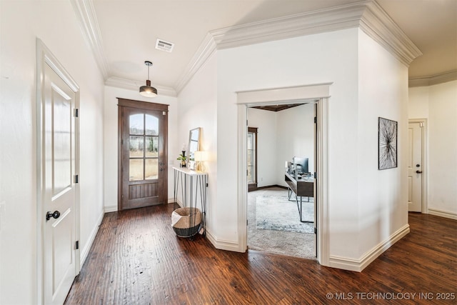 foyer entrance with dark hardwood / wood-style flooring and crown molding