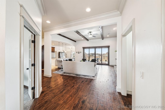 hall with beamed ceiling, wood-type flooring, and ornamental molding