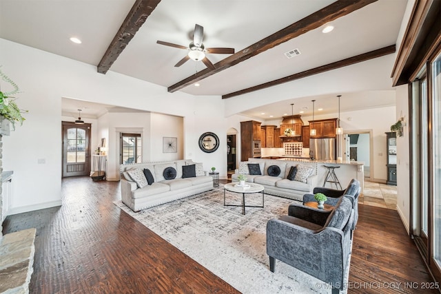 living room with ceiling fan, beamed ceiling, and dark hardwood / wood-style floors