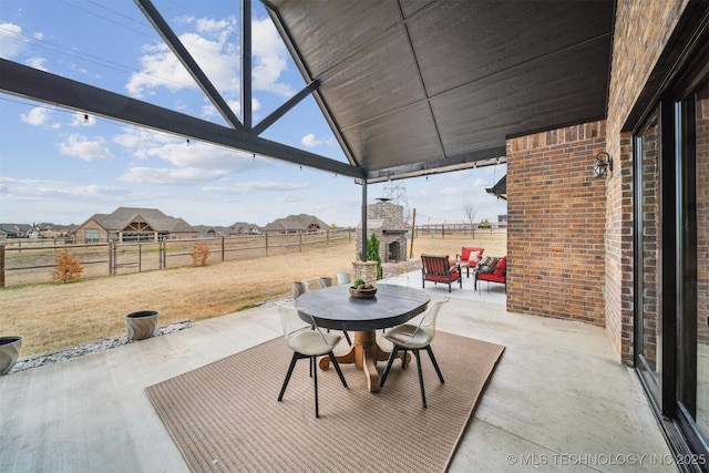 view of patio / terrace with an outdoor brick fireplace