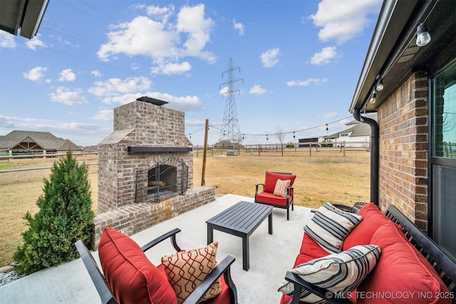 view of patio with an outdoor living space with a fireplace