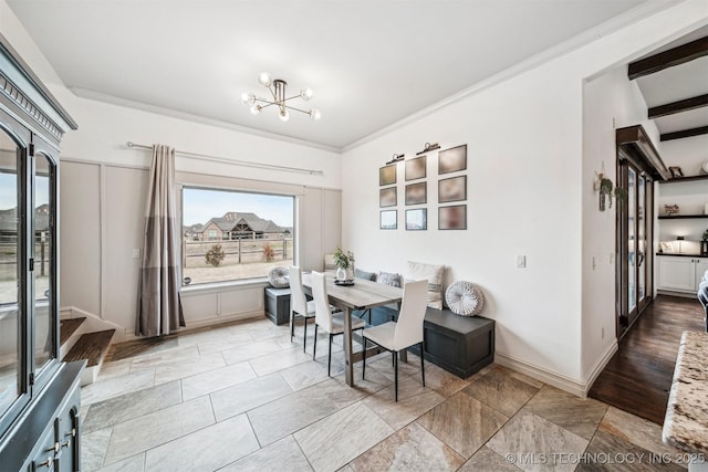 dining space with a notable chandelier and ornamental molding