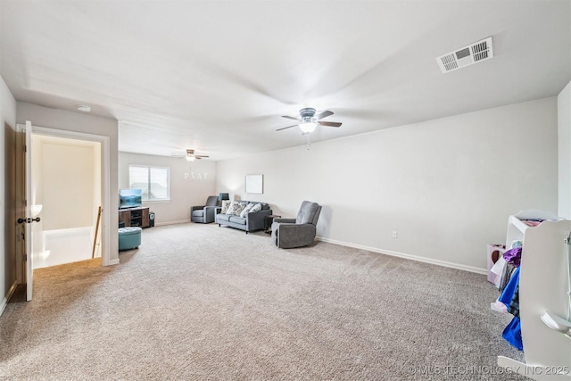 living area with carpet floors and ceiling fan