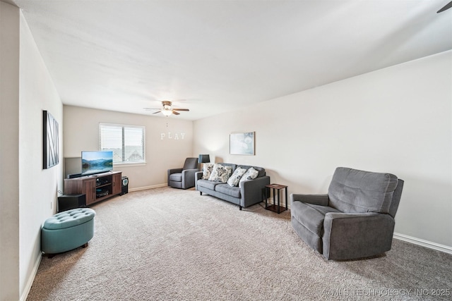 carpeted living room with ceiling fan