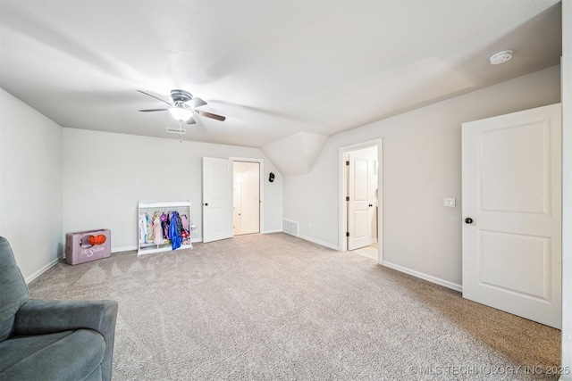 unfurnished room featuring ceiling fan, lofted ceiling, and light carpet