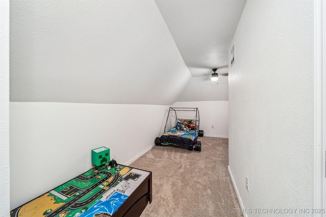 carpeted bedroom with vaulted ceiling