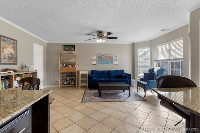 tiled living room with a textured ceiling, ceiling fan, and crown molding