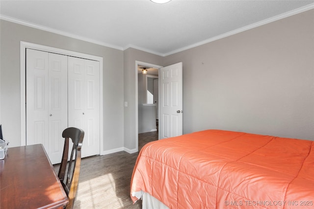 bedroom with dark hardwood / wood-style flooring, a closet, and crown molding