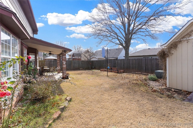 view of yard featuring ceiling fan and a patio area