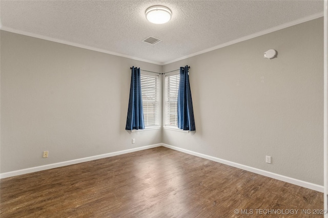 empty room featuring crown molding, dark hardwood / wood-style floors, and a textured ceiling