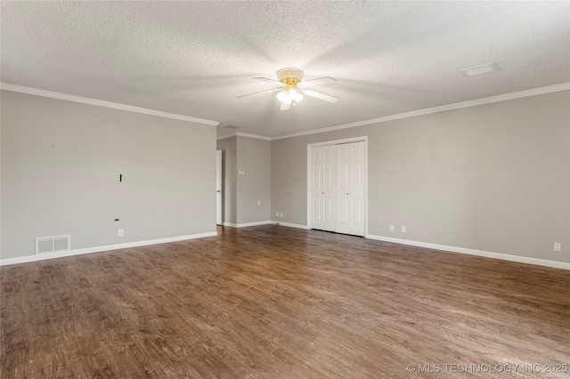 empty room featuring ceiling fan, ornamental molding, wood-type flooring, and a textured ceiling