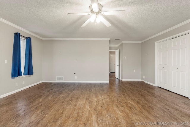 interior space featuring wood-type flooring, a textured ceiling, ceiling fan, and crown molding