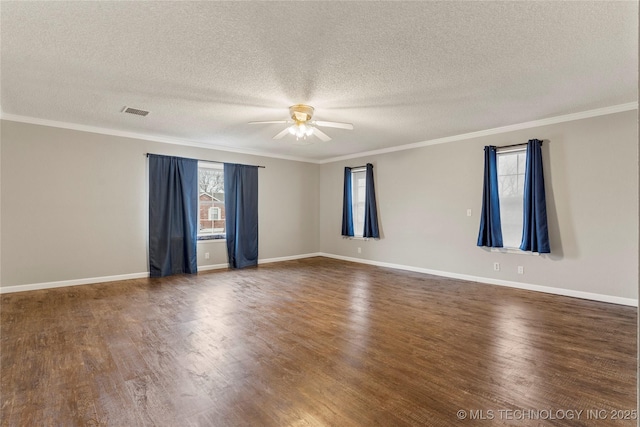 spare room featuring ceiling fan, ornamental molding, a textured ceiling, and dark hardwood / wood-style flooring