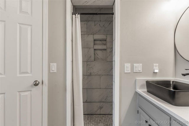 bathroom featuring vanity and curtained shower