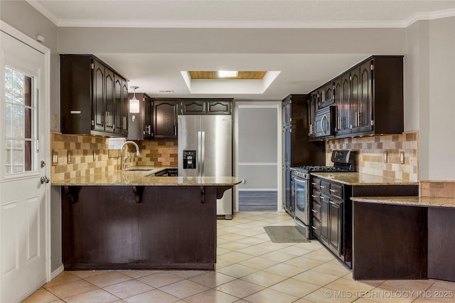 kitchen with stainless steel appliances, a breakfast bar, sink, and light tile patterned floors