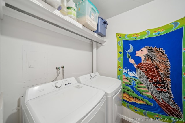 laundry area featuring washing machine and clothes dryer