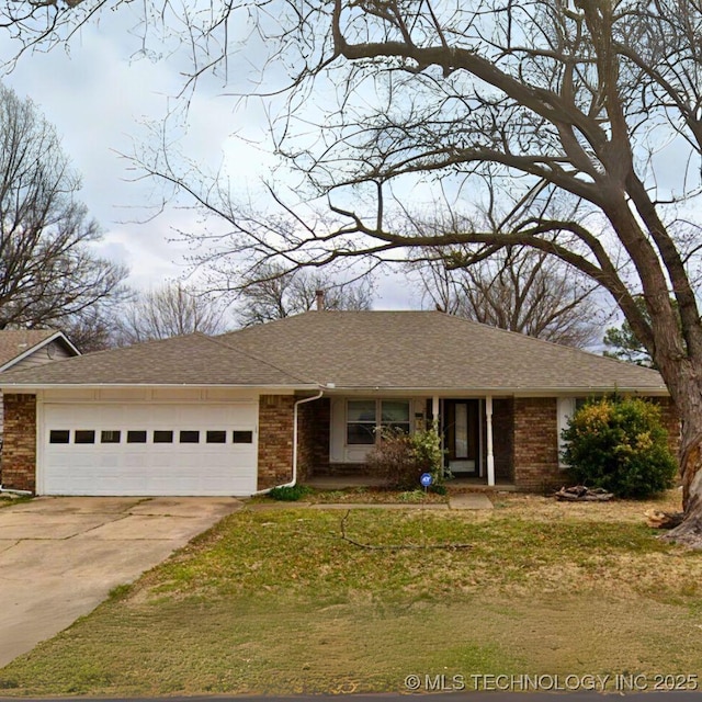 view of front facade with a garage and a front lawn