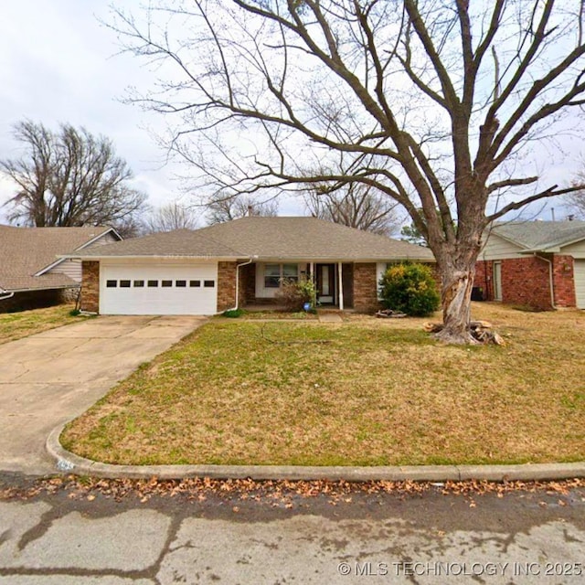 single story home with a front yard and a garage