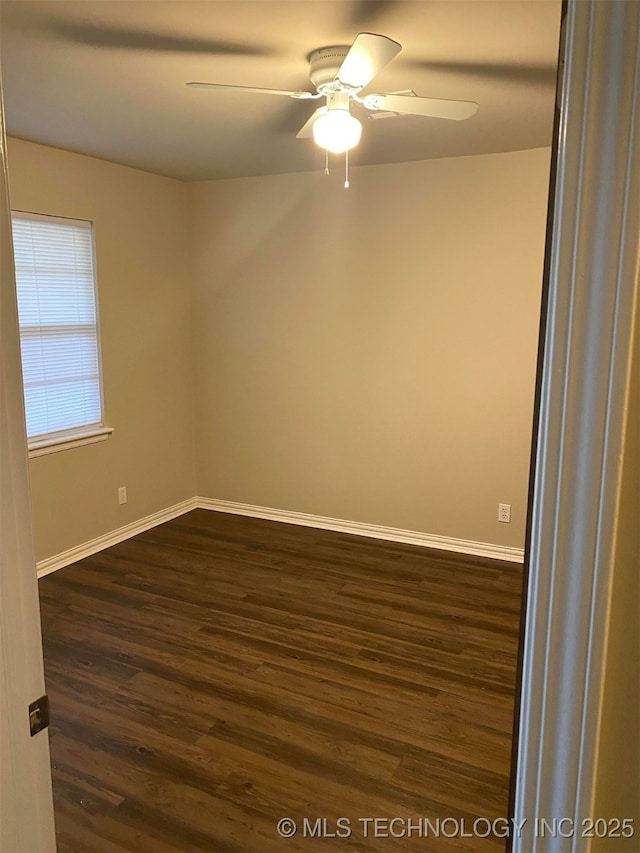 unfurnished room with ceiling fan and dark hardwood / wood-style flooring