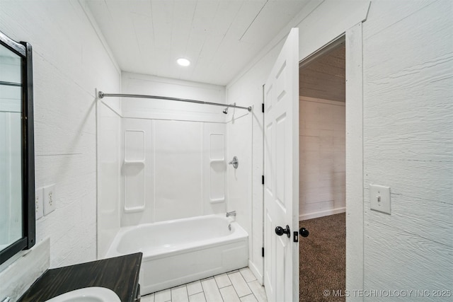 bathroom with wood walls, sink, and washtub / shower combination