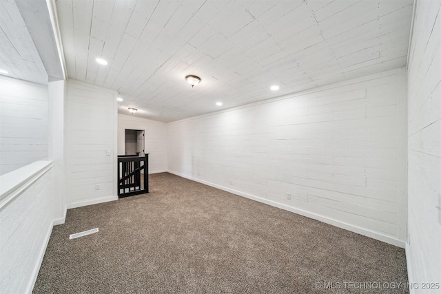 basement featuring dark carpet