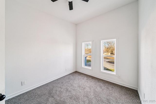 carpeted empty room featuring ceiling fan