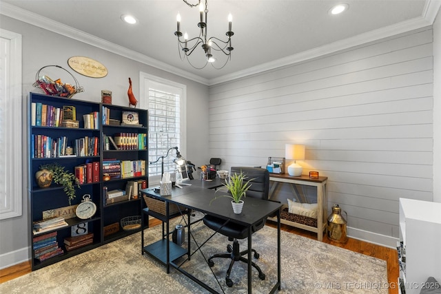 office with wood walls, hardwood / wood-style floors, a chandelier, and ornamental molding