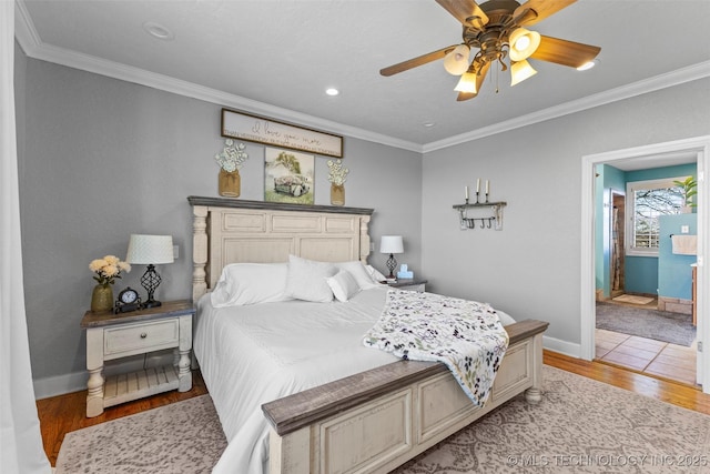 bedroom with connected bathroom, ceiling fan, crown molding, and light wood-type flooring