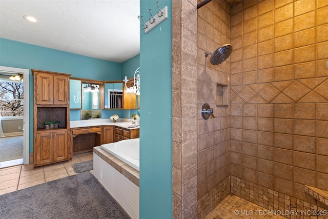 bathroom with tile patterned floors, vanity, and plus walk in shower